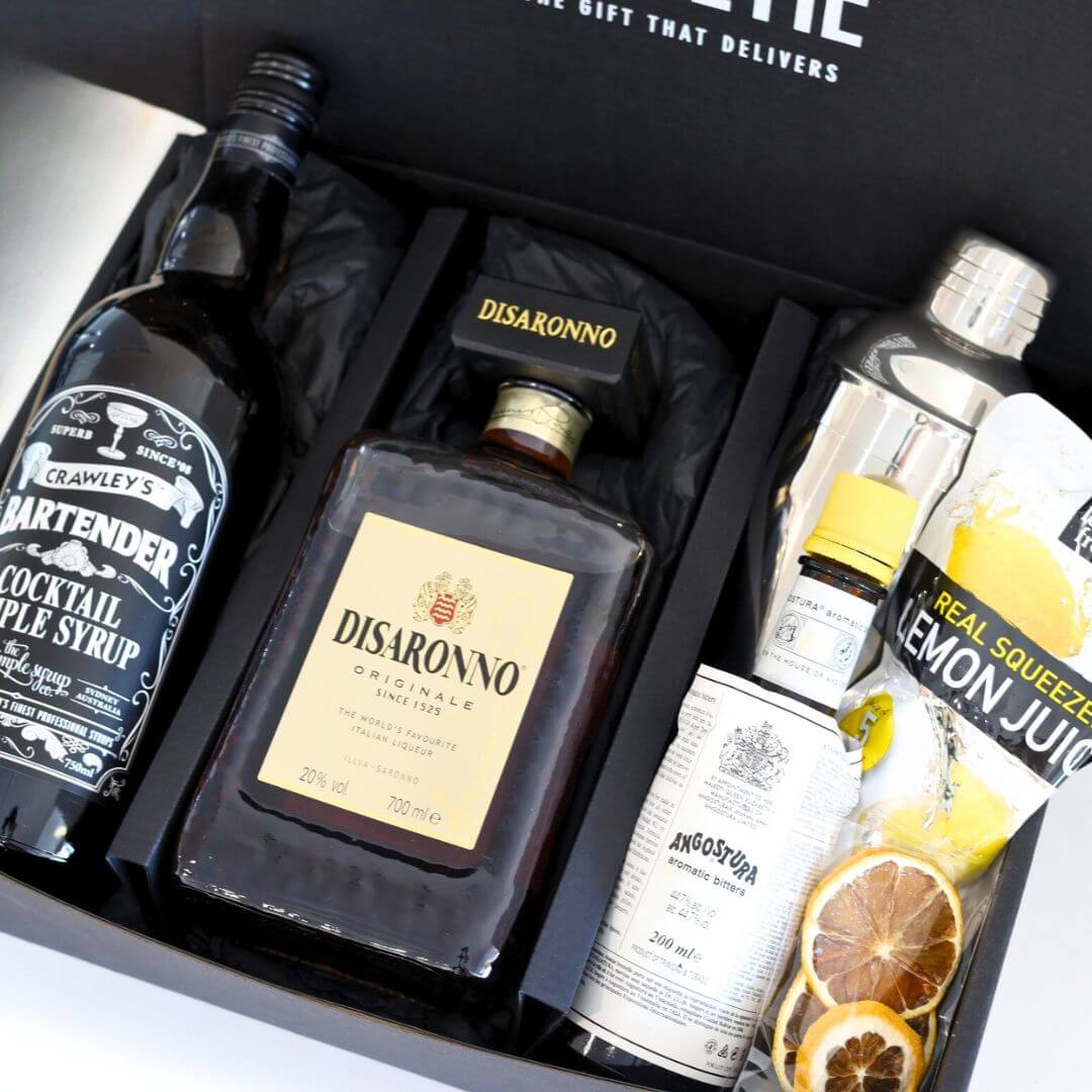 Amaretto Sour Cocktail gift set with bottles and ingredients in a box