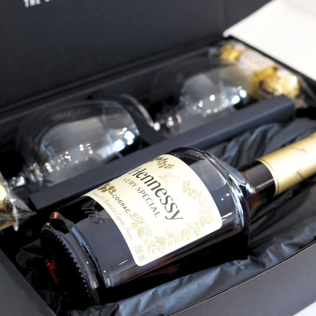 Hennessy VSOP cognac bottle with two glasses & chocolate in a gift hamper