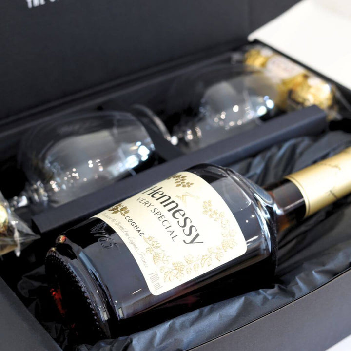 Hennessy VSOP cognac bottle with two glasses & chocolate in a gift hamper