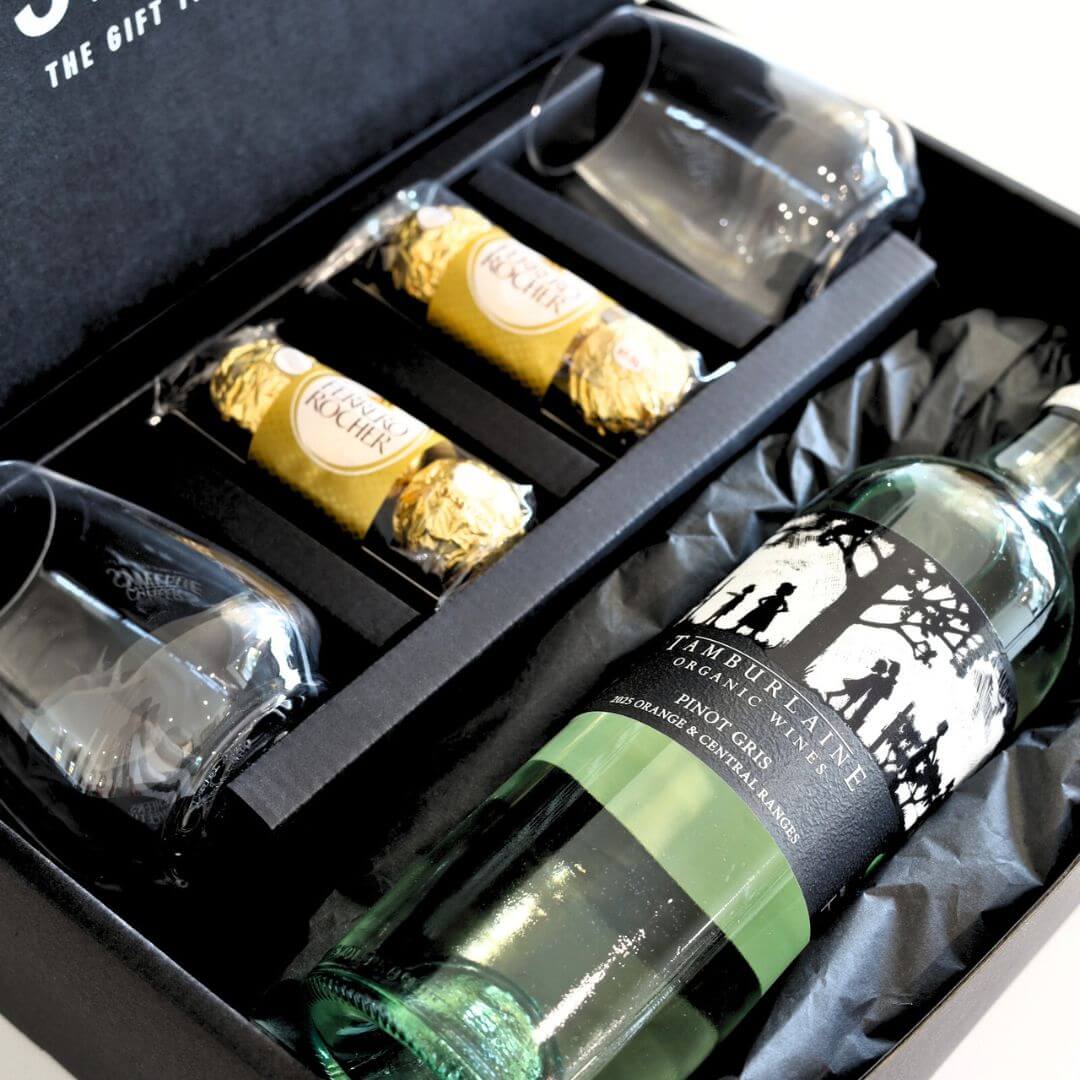 White Wine Gift set with two bottles, two glasses, and two chocolate bars in a black gift box.